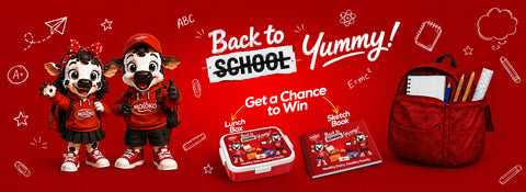 A promotional graphic for a school-themed snack or lunch box set, featuring two cartoon mascots in red outfits, a red lunch box, a sketch book, and a red backpack on a bright red background with school doodles and the text 'Back to SCHOOL Yummy!'.